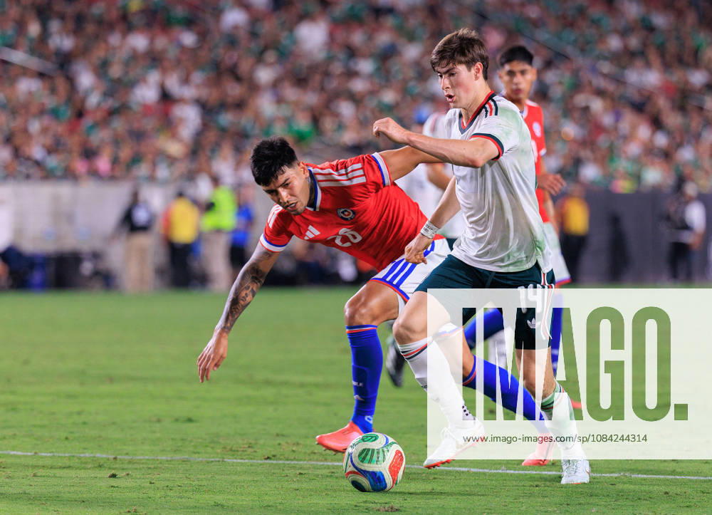 Armando Gonzalez 14 of Mexico wins the ball from Diego Ulloa 26 of Chile during an International Friendly, Länderspiel, Nationalmannschaft match at Los Angeles Memorial Coliseum on Tuesday, October 6, 2026, in Los Angeles, California. Mexico loses to Chile, 0-2. JAVIER ROJAS PI Los Angeles USA - ZUMAp124 20261006_zaa_p124_162