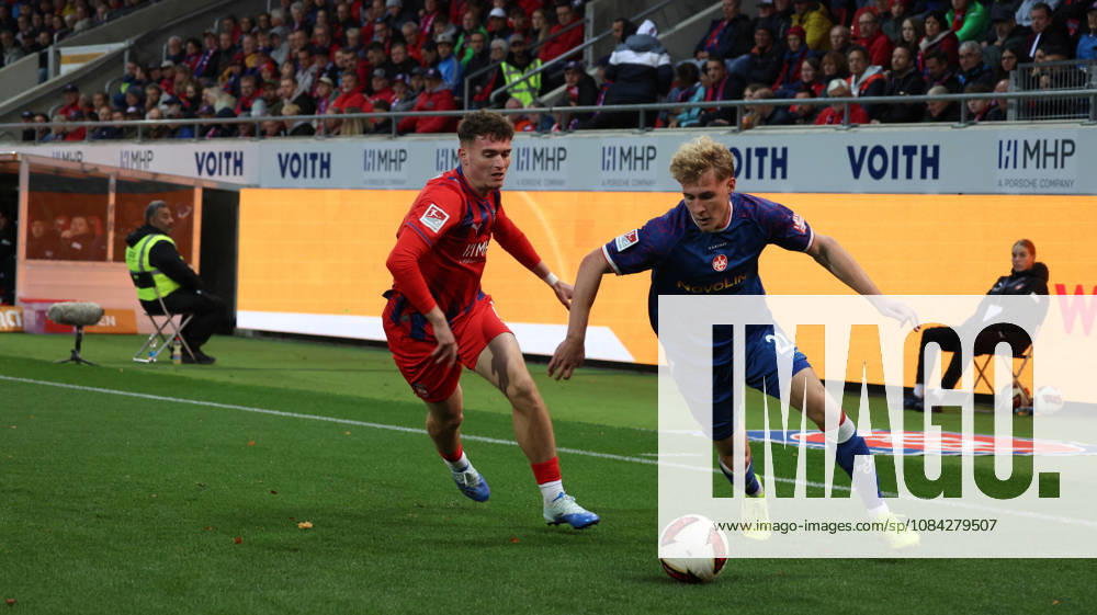 Soccer 2. Bundesliga, 1. FC Heidenheim vs. 1. FC Kaiserslautern, Paul Hennrich (1. FC Heidenheim 1846) vs. Mika Haas (1. FC Kaiserslautern), tackle, Action, battle for the ball. DFL and DFB regulations prohibit any use of photographs as image sequences and or quasi-video. Heidenheim