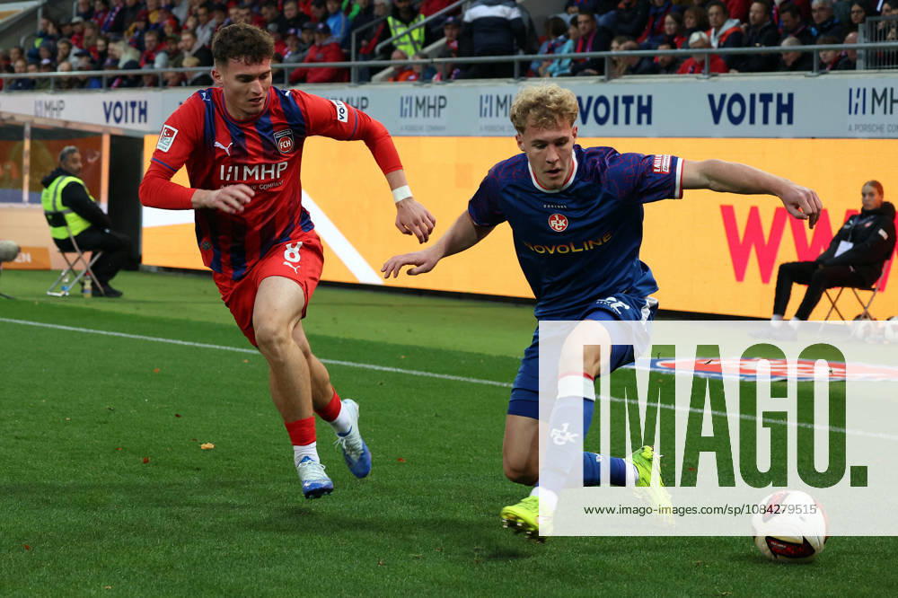 Soccer 2. Bundesliga, 1. FC Heidenheim vs. 1. FC Kaiserslautern, Paul Hennrich (1. FC Heidenheim 1846) vs. Mika Haas (1. FC Kaiserslautern), tackle, Action, battle for the ball. DFL and DFB regulations prohibit any use of photographs as image sequences and or quasi-video. Heidenheim