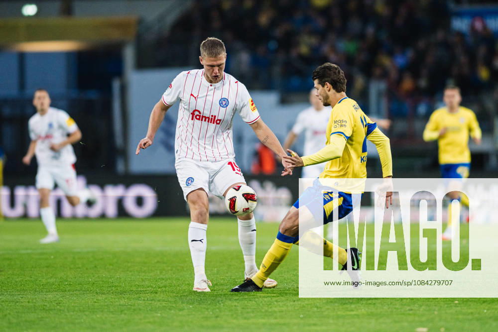 2. Bundesliga: Eintracht Braunschweig vs. Holstein Kiel, October 9, 2026—Phil Harre s Holstein Kiel (19) vs. Isidoros Koutsidis s Eintracht Braunschweig (23) in a soccer matchup, 2. Bundesliga, Matchday 7: Eintracht Braunschweig vs. Holstein Kiel on October 9, 2026, at Eintracht Stadium, Braunschweig. DFL regulations prohibit any use of photographs as image sequences and or quasi-video.