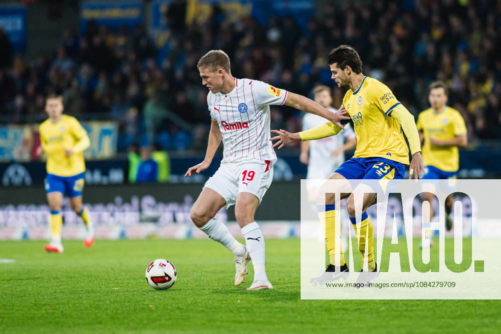2. Bundesliga: Eintracht Braunschweig vs. Holstein Kiel, October 9, 2026—Phil Harre’s Holstein Kiel (19) vs. Isidoros Koutsidis’s Eintracht Braunschweig (23) in a one-on-one soccer matchup, 2. Bundesliga, Matchday 7: Eintracht Braunschweig vs. Holstein Kiel on October 9, 2026, at Eintracht Stadium, Braunschweig. DFL regulations prohibit any use of photographs as image sequences and or quasi-video.