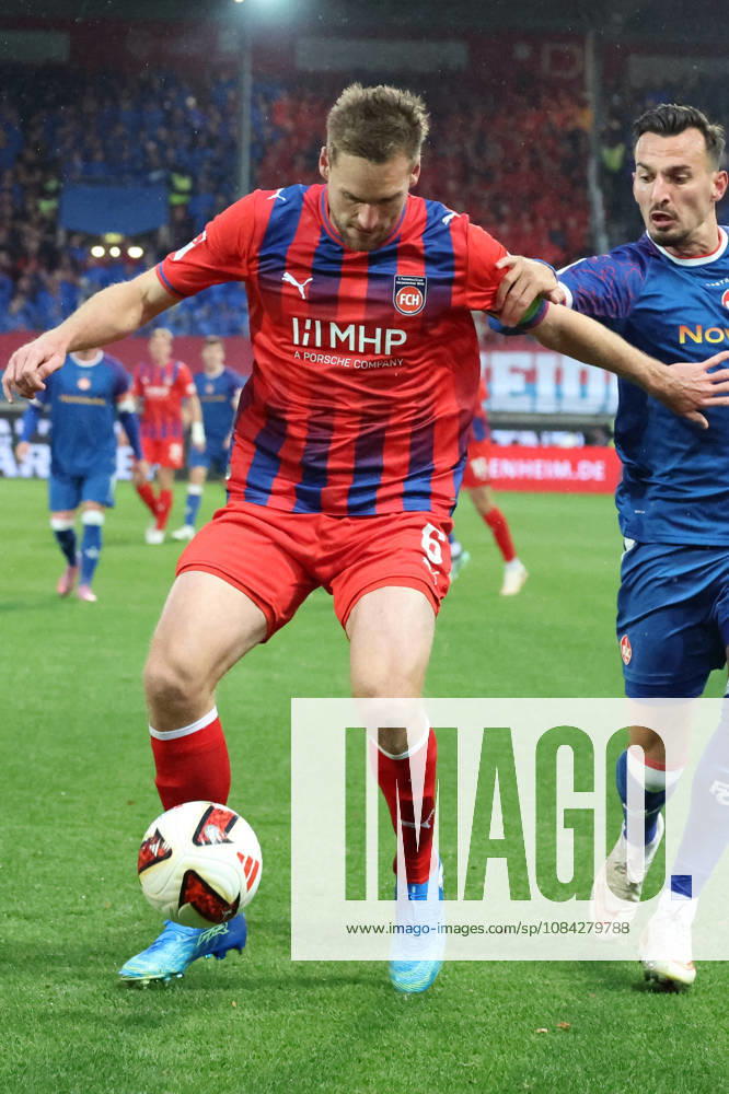 Soccer 2. Bundesliga, 1. FC Heidenheim vs. 1. FC Kaiserslautern: Patrick Mainka (1. FC Heidenheim) vs. Mergim Berisha (1. FC Kaiserslautern) – tackle, Action, battle for the ball. DFL and DFB regulations prohibit any use of photographs as image sequences and or quasi-video. Heidenheim