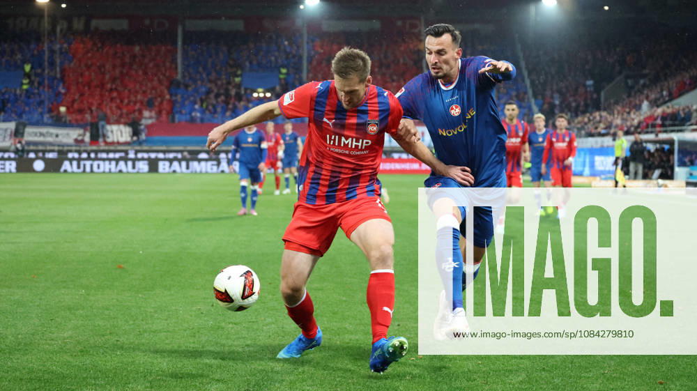 Soccer 2. Bundesliga, 1. FC Heidenheim vs. 1. FC Kaiserslautern: Patrick Mainka (1. FC Heidenheim) vs. Mergim Berisha (1. FC Kaiserslautern) – tackle, Action, battle for the ball. DFL and DFB regulations prohibit any use of photographs as image sequences and or quasi-video. Heidenheim