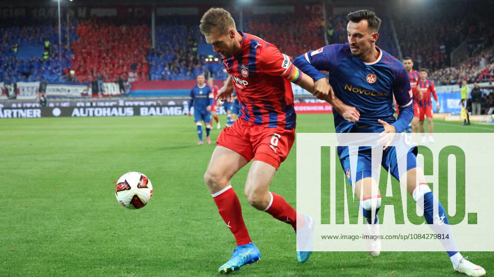 Soccer 2. Bundesliga, 1. FC Heidenheim vs. 1. FC Kaiserslautern: Patrick Mainka (1. FC Heidenheim) vs. Mergim Berisha (1. FC Kaiserslautern) – tackle, Action, battle for the ball. DFL and DFB regulations prohibit any use of photographs as image sequences and or quasi-video. Heidenheim