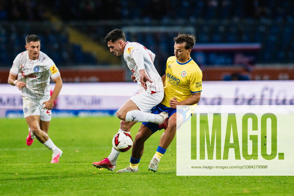 2. Bundesliga: Eintracht Braunschweig vs. Holstein Kiel, October 9, 2026—Guillermo Balzi (Holstein Kiel, No. 8) vs. Max Marie (Eintracht Braunschweig, No. 15) in a tackle during a soccer match, 2. Bundesliga, Matchday 7: Eintracht Braunschweig vs. Holstein Kiel on October 9, 2026, at Eintracht Stadium, Braunschweig. DFL regulations prohibit any use of photographs as image sequences and or quasi-video.