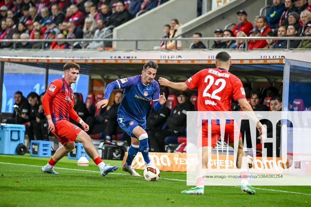Paul Hennrich, 1 FC Heidenheim 1846, Mergim Berisha of 1 FC Kaiserslautern and Oualid Mhamdi of 1 FC Heidenheim 1846 in a tackle during the 2. Bundesliga match between 1 FC Heidenheim and 1 FC Kaiserslautern, at the Voith Arena on October 9, 2026, in Heidenheim an der Brenz, Germany. Photo by Harry Langer, DeFodi Images. Paul Hennrich of 1 FC Heidenheim 1846, Mergim Berisha of 1 FC Kaiserslautern and Oualid Mhamdi of 1 FC Heidenheim 1846 battle for the ball during the 2nd Bundesliga match between 1 FC Heidenheim and 1 FC Kaiserslautern at Voith Arena on October 9, 2026 in Heidenheim an der Brenz, Germany Photo by Harry Langer DeFodi Images DFB and DFL regulations prohibit any use of photographs as image sequences and or quasi-video Photo by Harry Langer DeFodi Images DFB and DFL regulations prohibit any use of photographs as imSEQUENCES AND OR QUASI-VIDEO