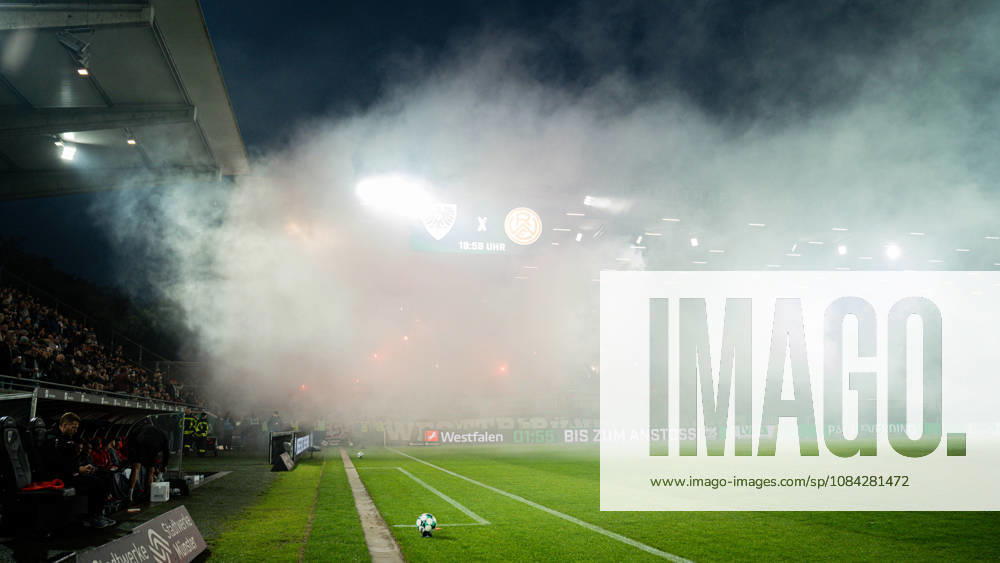 3rd Division, Matchday 8, SC Preußen Münster vs. Rot-Weiss Essen at the LVM Preußenstadion; Rot-Weiss Essen pyrotechnics in Münster IMPORTANT NOTICE: In accordance with DFB and DFL regulations, it is prohibited to use or allow the use of photographs taken in the stadium and or during the game in the form of sequential images and or video-like photo series.
