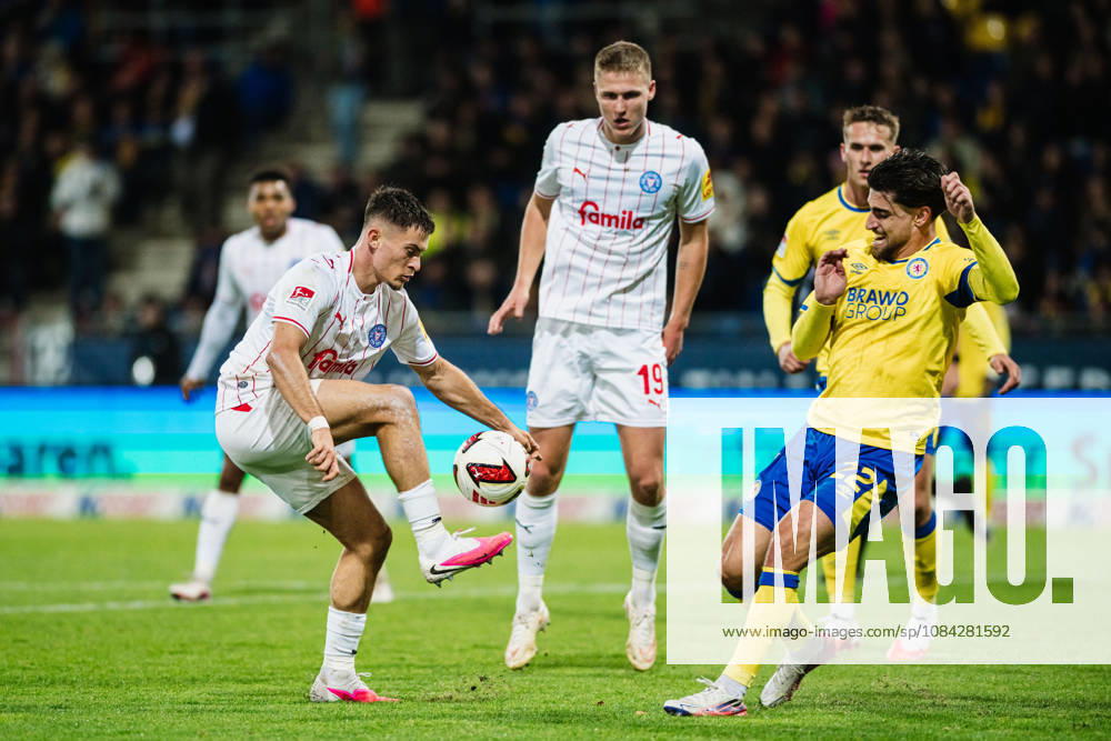 2. Bundesliga: Eintracht Braunschweig vs. Holstein Kiel, October 9, 2026; Adrian Kapralik (Holstein Kiel, No. 20) vs. Fabio Di Michele Sanchez (Eintracht Braunschweig, No. 22); tackle; soccer, 2. Bundesliga, Matchday 7: Eintracht Braunschweig vs. Holstein Kiel on October 9, 2026, at Eintracht Stadium, Braunschweig. DFL regulations prohibit any use of photographs as image sequences and or quasi-video.