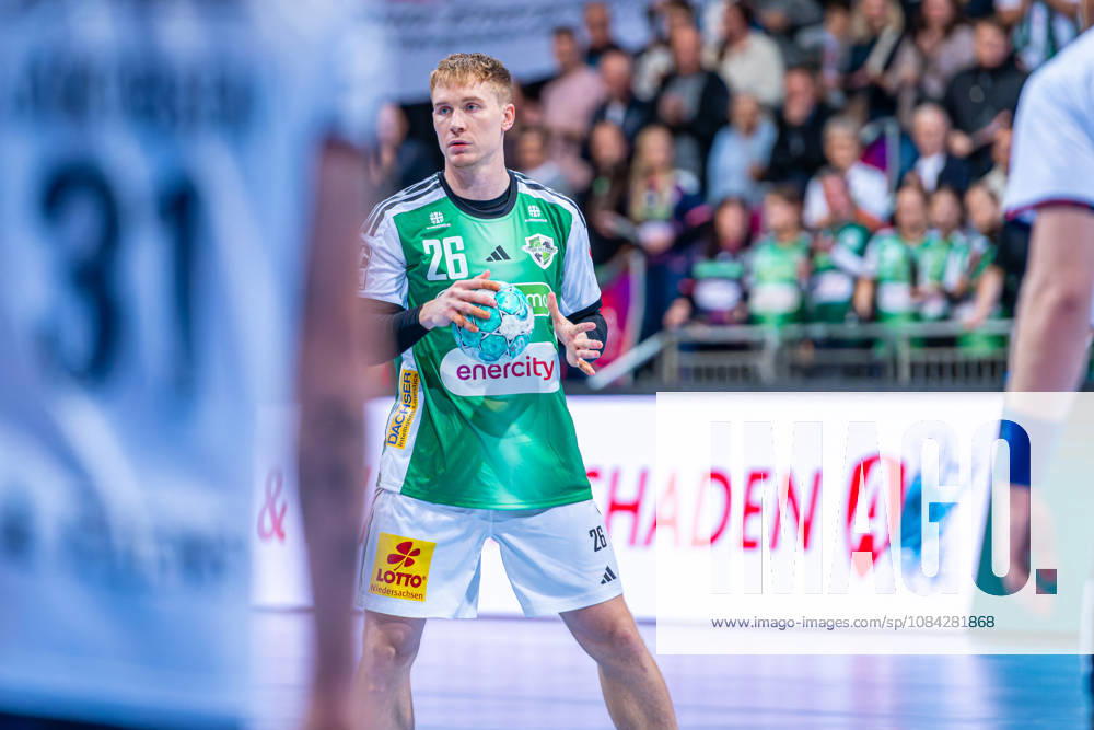 Jonathan Edvardsson of TSV Hannover Burgdorf, No. 26 (left), TSV Hannover Burgdorf (green) vs. SG Flensburg Handewitt (blue) on Matchday 8 of the 2026–2027 season in the Opel Handball Bundesliga on October 9, 2026, ZAG Arena Hannover, GER,