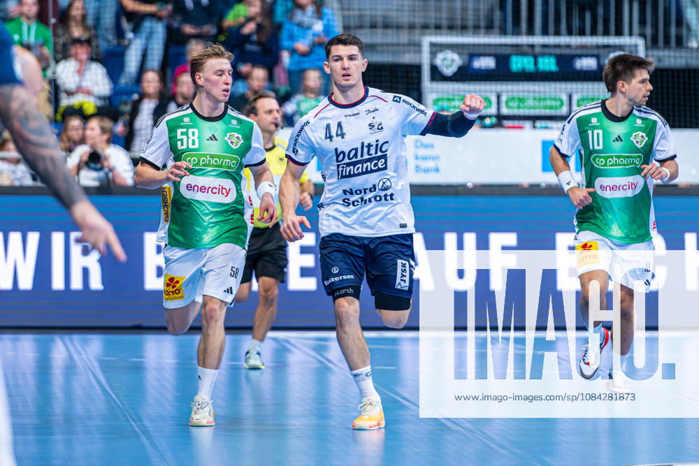 Aymeric Minne of SG Flensburg Handewitt, No. 44 (left), TSV Hannover Burgdorf (green) vs. SG Flensburg Handewitt (blue) on Matchday 8 of the 2026–2027 season in the Opel Handball Bundesliga on October 9, 2026, ZAG Arena Hannover, GER,