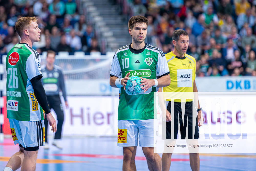 Renars Uscins of TSV Hannover Burgdorf, No. 10 from the left, TSV Hannover Burgdorf (green) vs. SG Flensburg Handewitt (blue) on Matchday 8 of the 2026–2027 season in the Opel Handball Bundesliga on October 9, 2026, ZAG Arena Hannover, GER,
