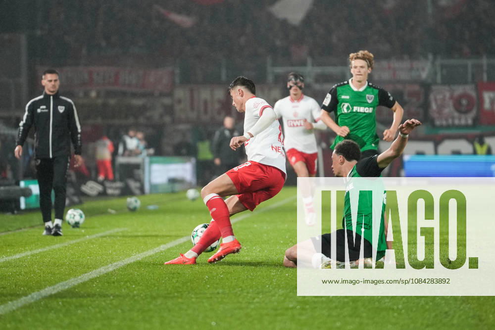 Germany 3rd Division 2026–2027, Matchday 8: SC Preußen Münster vs. Rot-Weiß Essen, Friday, October 9, 2026, LVM Preußenstadion, Münster, North Rhine-Westphalia, Germany; Tackle between Samuel Althaus (SC Preußen Münster, No. 44) and Semir Telalovic (RW Essen, No. 17)