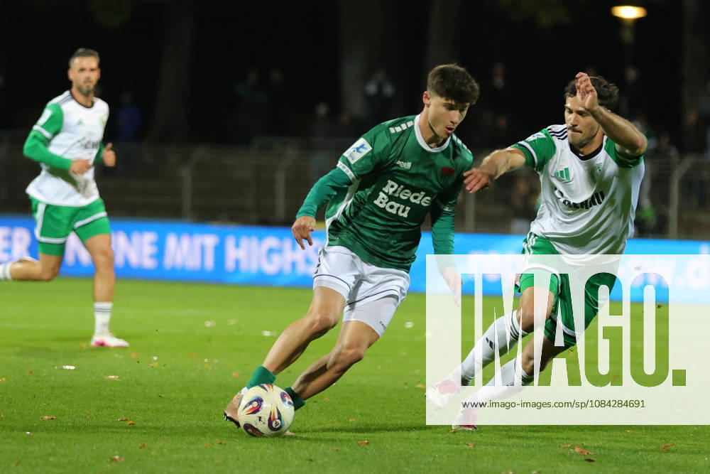 Soccer, Men s, Bavarian Regional League, 2026–2027 Season, Matchday 13: FC Schweinfurt 05 vs. SC Eltersdorf. From left: Lauris Bausenwein (FC Schweinfurt 05, No. 21) and Patrick Ort (SC Eltersdorf, No. 14). Schweinfurt, Riedel Bau Arena at Sachs Stadio, Bavaria, Lower Franconia, Germany