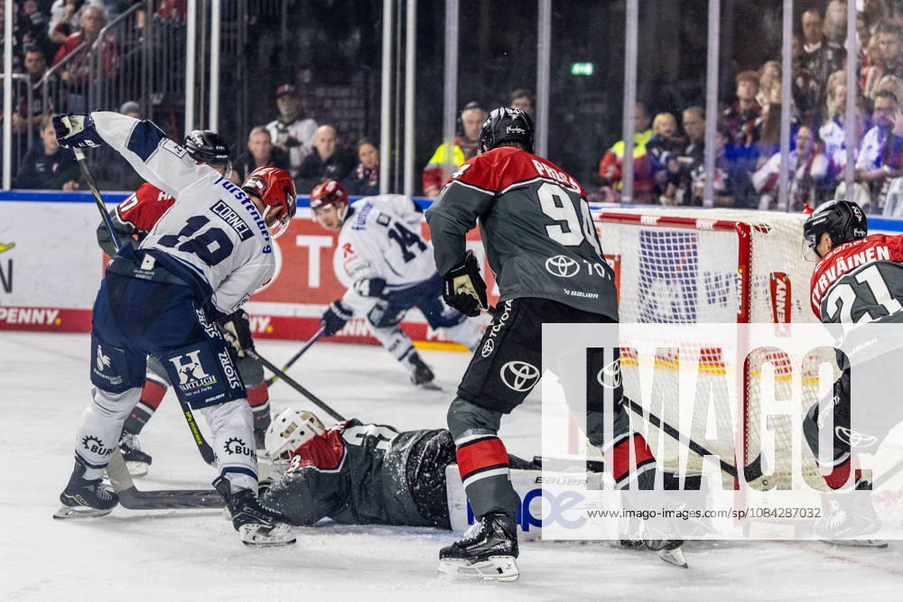 Eric Cornel of the Schwenninger Wild Wings, No. 18, in front of the Cologne Haie goal, Nico Wien of the Cologne Sharks, No. 33, is on the ice; Robin Press of the Cologne Sharks, No. 94, watches as the Cologne Sharks face the Schwenninger Wild Wings, ice hockey, Penny DEL, Matchday 07, 2026–2027, October 9, 2026, Cologne Sharks vs. Schwenninger Wild Wings, Ice Hockey, Penny DEL, Matchday 07, 2026–2027, October 9, 2026, Cologne
