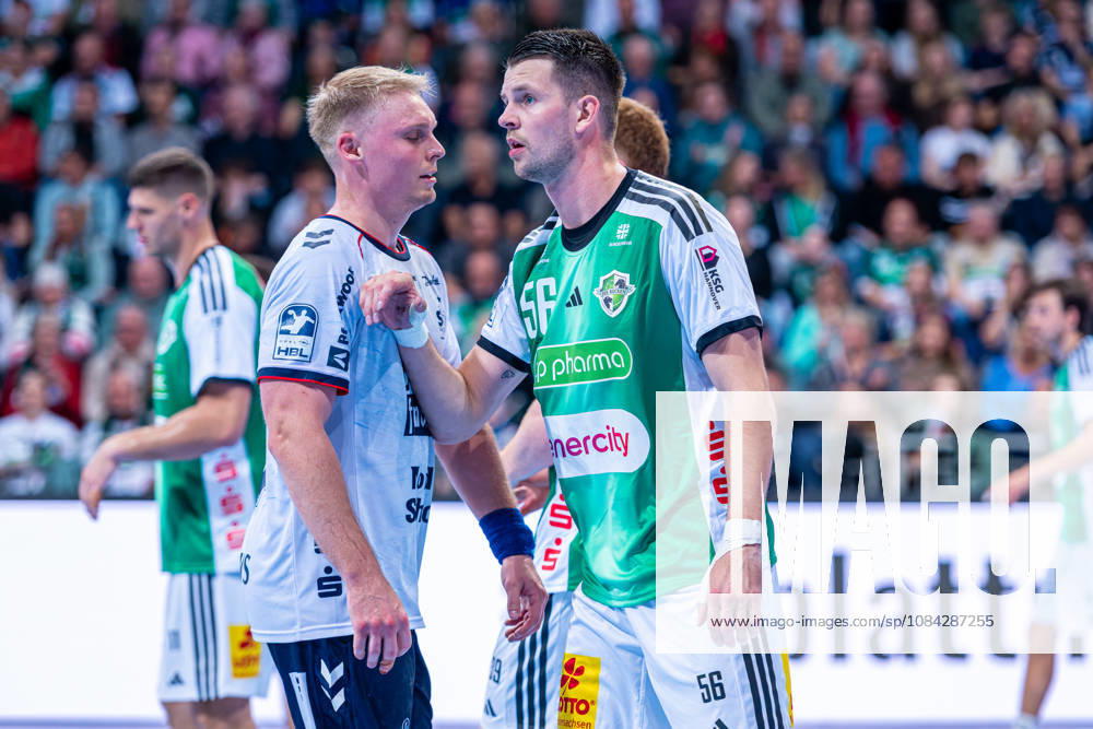 Hannes Feise of TSV Hannover Burgdorf, No. 56 (left), TSV Hannover Burgdorf (green) vs. SG Flensburg Handewitt (blue) on Matchday 8 of the 2026–2027 season in the Opel Handball Bundesliga on October 9, 2026, ZAG Arena Hannover, GER,