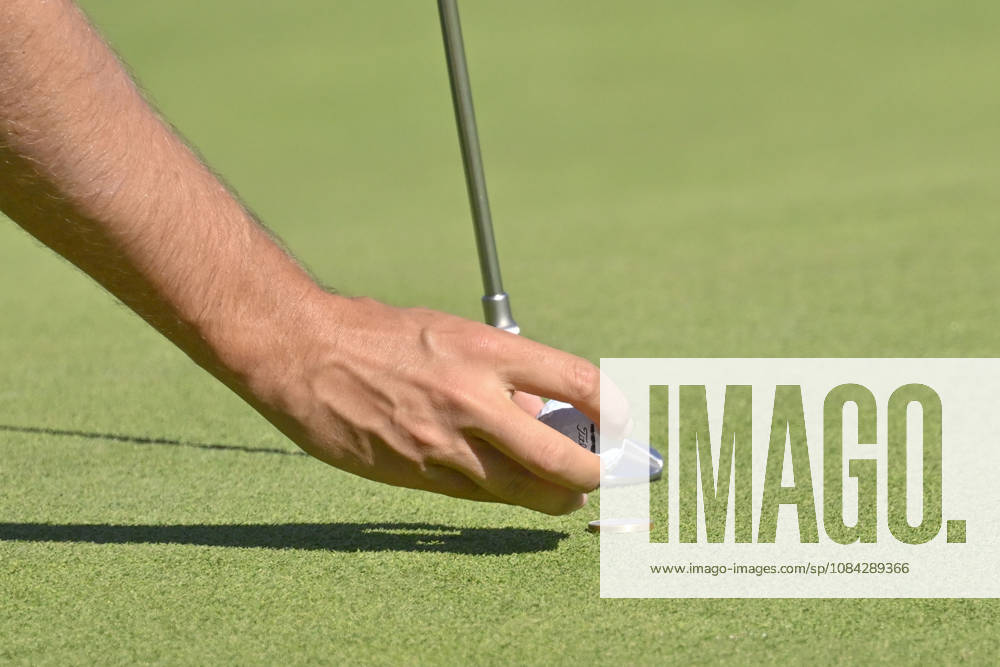 Close-up of a playerâ€⠢s hand placing the ball on the mark during the Open de Espao±a presented by Madrid at Club de Campo Villa de Madrid on October 09, 2026 in Madrid, Spain. Madrid Spain - ZUMAc312 20261009_zsp_c312_432
