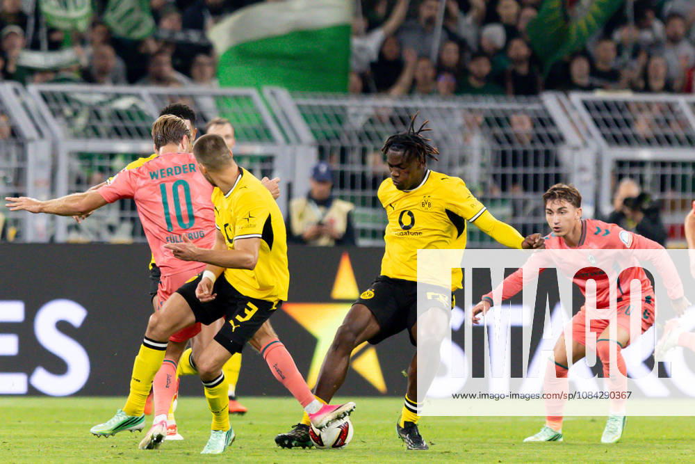 Dortmund, Germany, October 9, 2026, Bundesliga 1, 2026–2027, Matchday 5: Borussia Dortmund vs. SV Werder Bremen. Pictured, from left, in a tackle: Niclas Füllkrug (SVW), Waldemar Anton (BVB), Joane Gadou (BVB), and Chuki (SVW). DFL and DFB regulations prohibit any use of photographs as image sequences and or quasi-video. Signal Iduna Park, North Rhine-Westphalia