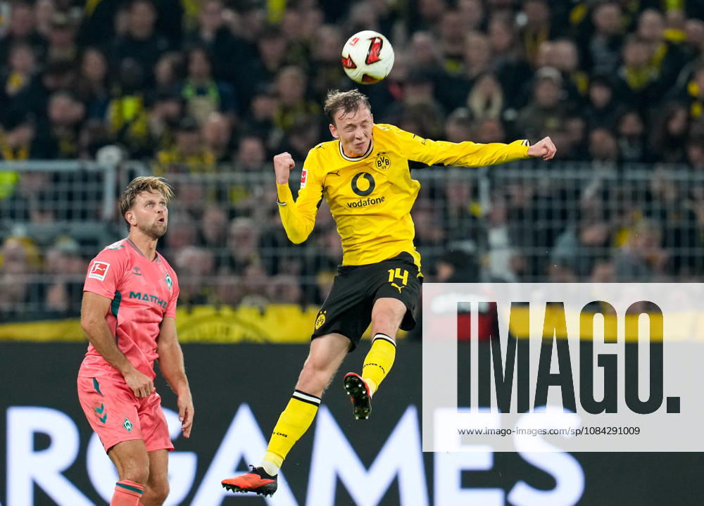 Maximilian Beier of Borussia Dortmund, No. 14, jumps for a header while Niclas Füllkrug of SV Werder Bremen, No. 10, looks on. GER, Borussia Dortmund vs. SV Werder Bremen, Bundesliga 1, Matchday 5, 2026–27 season, SIGNAL IDUNA PARK, Dortmund, October 9, 2026. DFL regulations prohibit any use of photographs as image sequences and or quasi-video. Borussia Dortmund vs. SV Werder Bremen, Bundesliga 1, Matchday 5, 2026–27 season, October 9, 2026, Dortmund