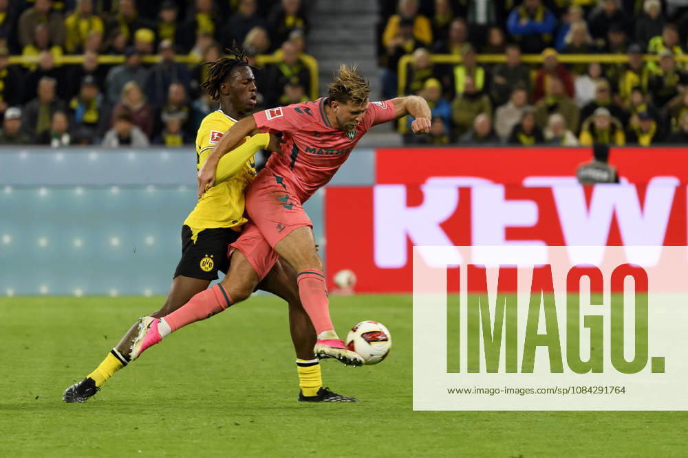 Joane Gadou of Borussia Dortmund and Niclas Fuellkrug of SV Werder Bremen battle for the ball during the Bundesliga match between Borussia Dortmund and SV Werder Bremen at Signal Iduna Park on October 9, 2026, in Dortmund, Germany Photo by Max Maiwald DeFodi Images Joane Gadou of Borussia Dortmund and Niclas Füllkrug of SV Werder Bremen battle for the ball during the Bundesliga match between Borussia Dortmund and SV Werder Bremen at Signal Iduna Park on October 9, 2026 in Dortmund, Germany. Photo by Max Maiwald, DeFodi Images. DFB and DFL regulations prohibit any use of photographs as image sequences and or quasi-video. Photo by Max Maiwald, DeFodi Images.