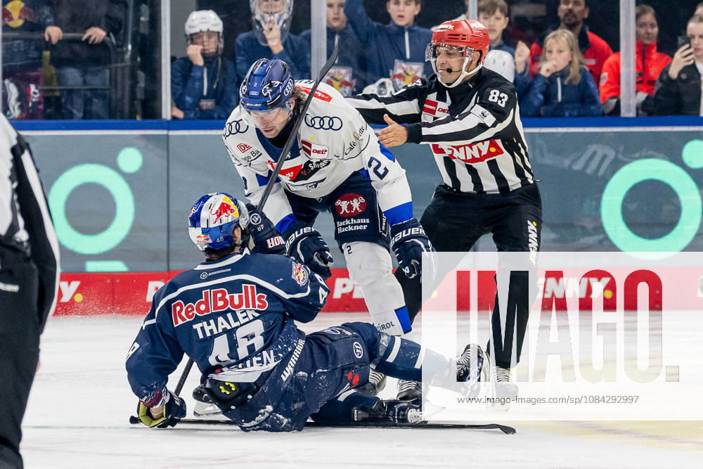 Sam Ruopp (ERC Ingolstadt), No. 02, against Lucas Thaler (EHC Red Bull Munich), No. 48, with linesman David Tschirner (GER) behind them; EHC Red Bull Munich vs. ERC Ingolstadt, DEL, 2026–2027 season, Matchday 7, October 9, 2026. Photo by HMB Media, Franz Feiner