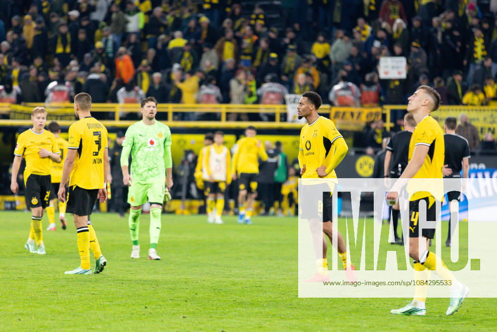 Dortmund, Germany, October 9, 2026, Bundesliga 1, 2026–2027, Matchday 5: Borussia Dortmund vs. SV Werder Bremen. Pictured: Disappointed Dortmund players after the 2–2 draw. From left: Waldemar Anton (BVB), Felix Nmecha (BVB), Nico Schlotterbeck (BVB). DFL and DFB regulations prohibit any use of photographs as image sequences and or quasi-video. Signal Iduna Park, North Rhine-Westphalia