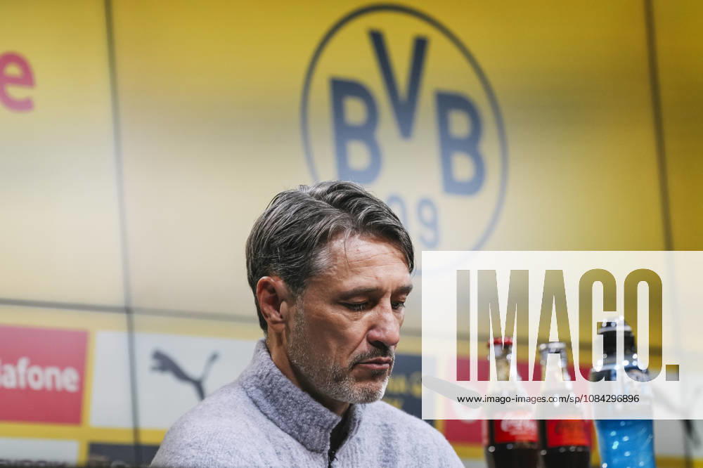 Soccer, Bundesliga 1, Borussia Dortmund vs. SV Werder Bremen; Head Coach Niko Kovac looks down; in the background, the Borussia Dortmund logo. DFL and DFB regulations prohibit any use of photographs as image sequences and or quasi-video. Dortmund