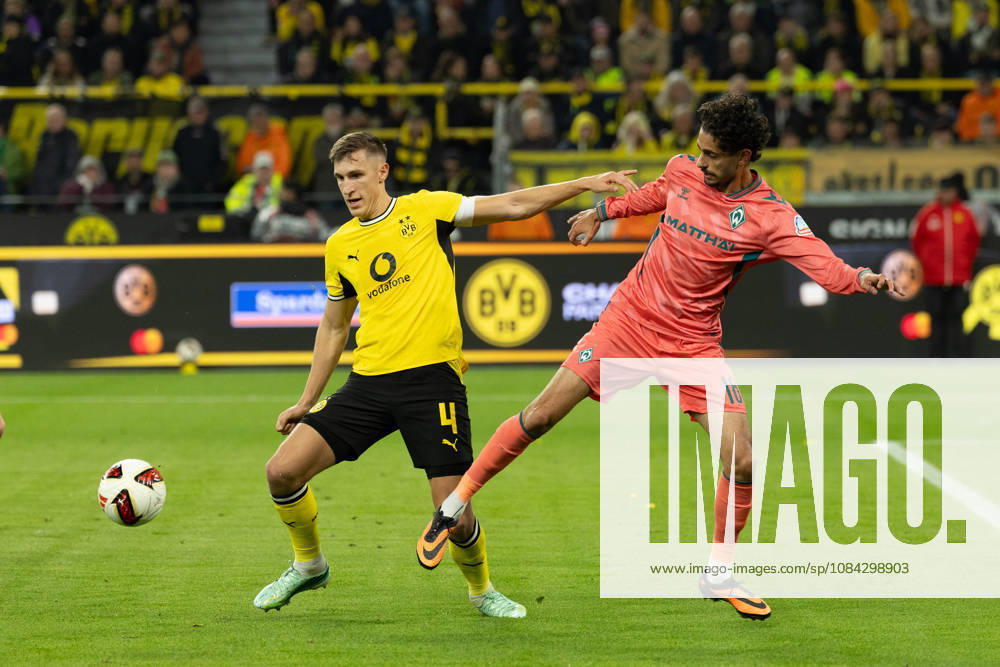 Dortmund, Germany, October 26, 2009, Nico Schlotterbeck of Borussia Dortmund and Eren Dinkci of SV Werder Bremen in a tackle during the Bundesliga match between Borussia Dortmund and SV Werder Bremen at Signal Iduna Park in Dortmund. Photo by Joachim Bywaletz. DFB and DFL regulations prohibit any use of photographsOGRAPHS AS IMAGE SEQUENCES AND OR QUASI-VIDEO