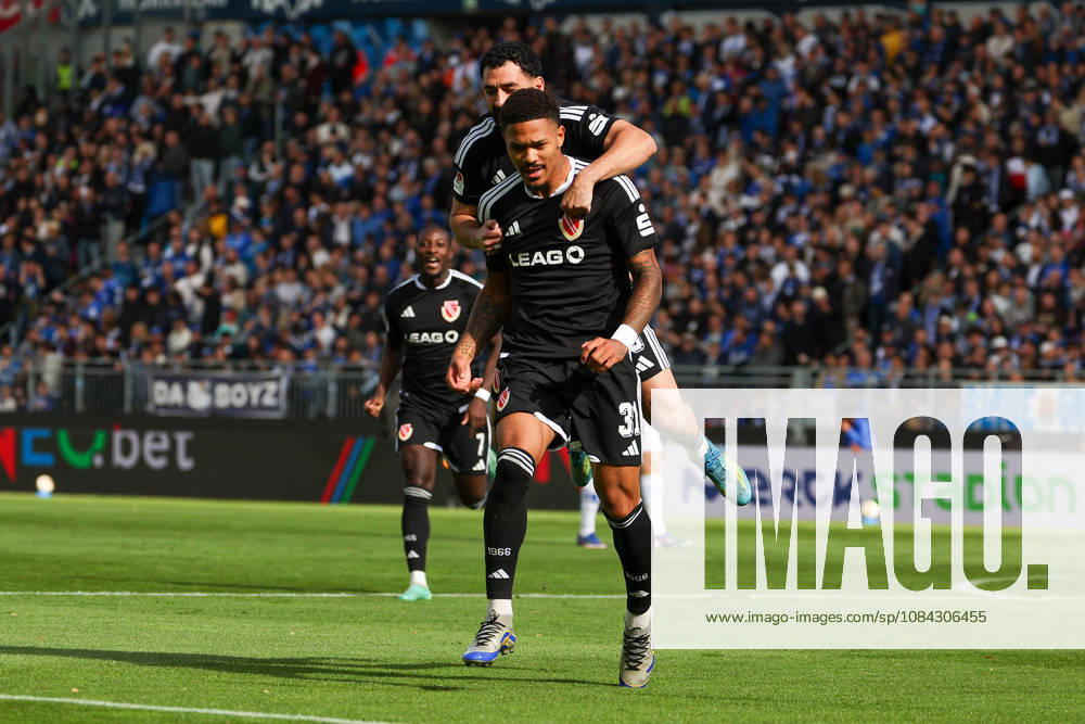 Soccer, 2. Bundesliga, SV Darmstadt 98 vs. Energie Cottbus, from left: Tolcay Cigereci (Energie Cottbus) and Justin Butler (Energie Cottbus) are seen celebrating after scoring a goal to make the score 0–1