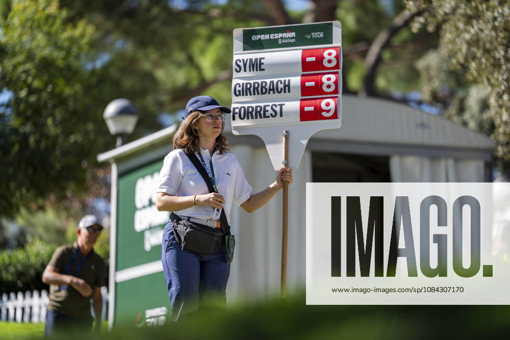 Golf 2026: Open De Espana: Day Three MADRID, SPAIN - OCTOBER 10: A volunteer holds up the leaderboard showing the standings as the tournament s top three players tee off on day three of the Open de Espana presented by Madrid at Club de Campo Villa de Madrid on October 10, 2026 in Madrid, Spain. Madrid Club de Campo Villa de Madrid Madrid Spain