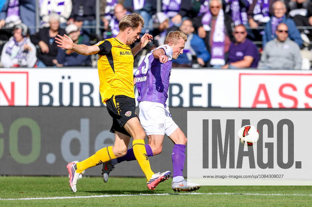 Soccer, 2. Bundesliga, VfL Osnabrück vs. SG Dynamo Dresden, Stadion an der Bremer Brücke, Matchday 7, 2026–2027 Season: Vincent Vermeij of SG Dynamo Dresden (No. 9) in a tackle against Niklas Wiemann of VfL Osnabrück (No. 25). DFB regulations prohibit any use of photographs as image sequences and or quasi-video. Photo: WilkowskixPressefotoKochx, Lower Saxony Germany