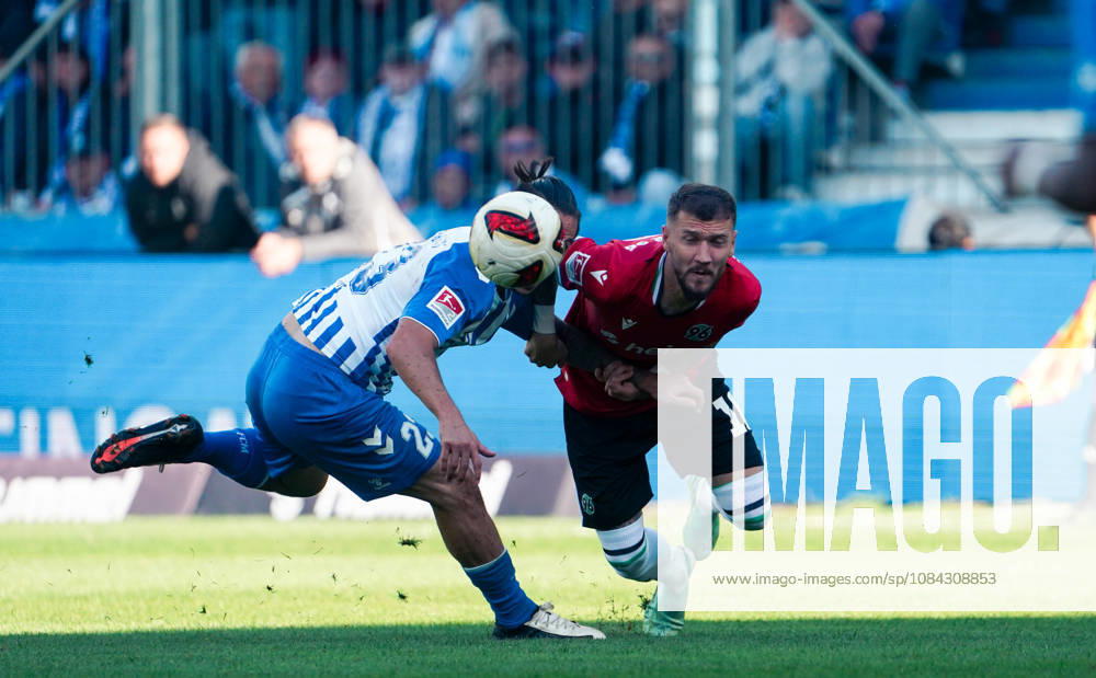 Germany Soccer 2. Bundesliga 2026–2027, Matchday 7: 1. FC Magdeburg vs. Hannover 96 at Avnet Arena, Magdeburg—BarıÅü Atik (1. FC Magdeburg) and Marcel Hartel (Hannover 96) in a tackle. 1. FC Magdeburg, 23; Hannover 96, 10; Avnet Arena, Magdeburg, Lower Saxony, Germany
