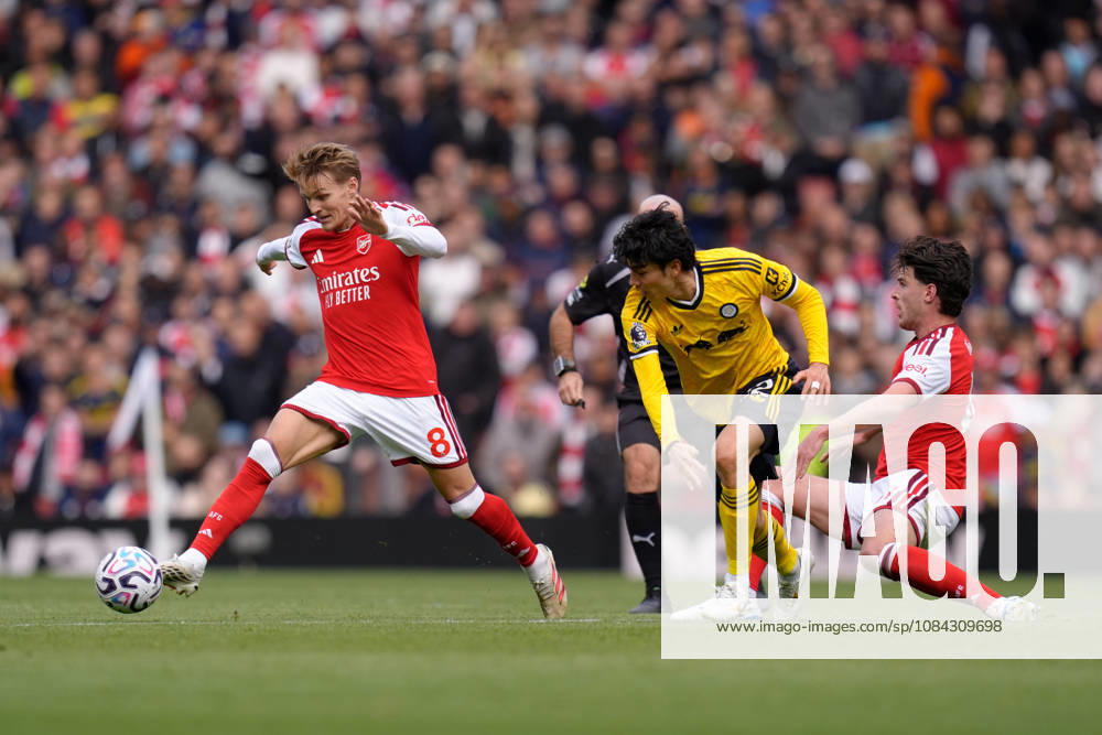 10th October 2026; Emirates Stadium, London, England; Premier League Football, Arsenal versus Leeds United; Martin Odegaard of Arsenal runs with the ball under pressure from Ao Tanaka TomxMajor