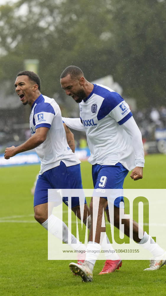 Hänsch Arena, Meppen, GER, 3. Liga, Matchday 9: SV Meppen vs. VfB Stuttgart II, Oliver Schmitt of SV Meppen 7 celebrates with Cyrill Akono of SV Meppen 9 after the 1–1 tie. DFL REGULATIONS PROHIBIT ANY USE OF PHOTOGRAPHS AS IMAGE SEQUENCES AND OR QUASI-VIDEO. Meppen, Lower Saxony, Hänsch Arena