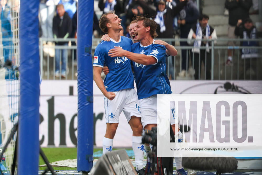 Soccer, 2. Bundesliga: SV Darmstadt 98 vs. Energie Cottbus; from left: Yannik Luehrs (SV Darmstadt 98), Kai Klefisch (SV Darmstadt 98), and Fynn Luca Lakenmacher (SV Darmstadt 98) are seen celebrating after scoring a goal to make the score 3–1.