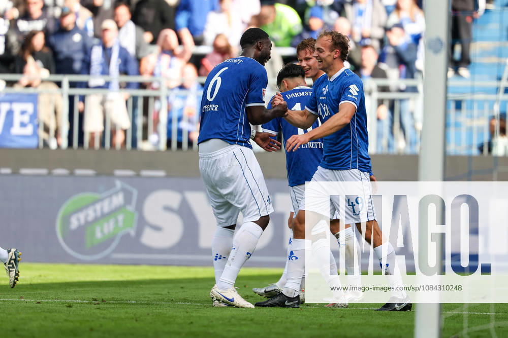 Soccer, 2. Bundesliga, SV Darmstadt 98 vs. Energie Cottbus; Patric Pfeiffer of SV Darmstadt 98 and Yannik Luehrs of SV Darmstadt 98 are seen celebrating after scoring a goal to make the score 3–1.