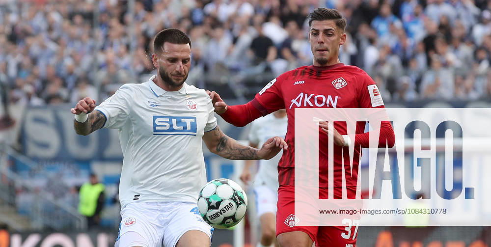 Men s, Soccer, 2026–2027 Season, 3rd Division, Matchday 8: FC Würzburger Kickers vs. FC Hansa Rostock; from left: Leon Dajaku (FC Hansa Rostock), Ivan Franjic (FC Würzburger Kickers); Würzburg, AKON ARENA, Bavaria, Germany