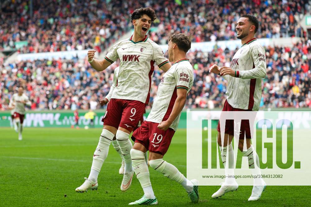 Goal celebration by Robin Fellhauer (19, FC Augsburg) for the 1-0 lead; Rodrigo Ribeiro (9, FC Augsburg); Arijon Ibrahimovic (21, FC Augsburg); FC Augsburg vs. FC Bayern Munich; soccer; Bundesliga 1, Matchday 5, October 10, 2026. DFB and DFL regulations prohibit any use of photographs as image sequences and or quasi-video. Augsburg, Bayern, Germany