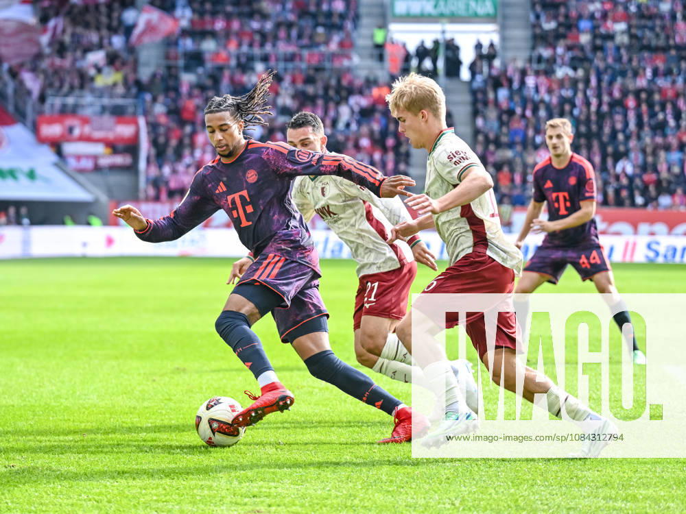 Michael Olise of FC Bayern Munich, Arijon Ibrahimovic of FC Augsburg, and Hennes Behrens of FC Augsburg battle for the ball during the Bundesliga match between FC Augsburg and FC Bayern Munich at the WWK Arena on October 10, 2026, in Augsburg, Germany Photo by Harry Langer DeFodi Images Michael Olise of FC Bayern Munich, Arijon Ibrahimovic of FC Augsburg, and Hennes Behrens of FC Augsburg battle for the ball during the Bundesliga match between FC Augsburg and FC Bayern Munich at WWK Arena on October 10, 2026, in Augsburg, Germany. Photo by Harry Langer, DeFodi Images. DFB and DFL regulations prohibit any use of photographs as image sequences and or quasi-video. Photo by Harry Langer, DeFodi Images. DFB and DFL regulations prohibit any use of photographs as imSEQUENCES AND OR QUASI-VIDEO