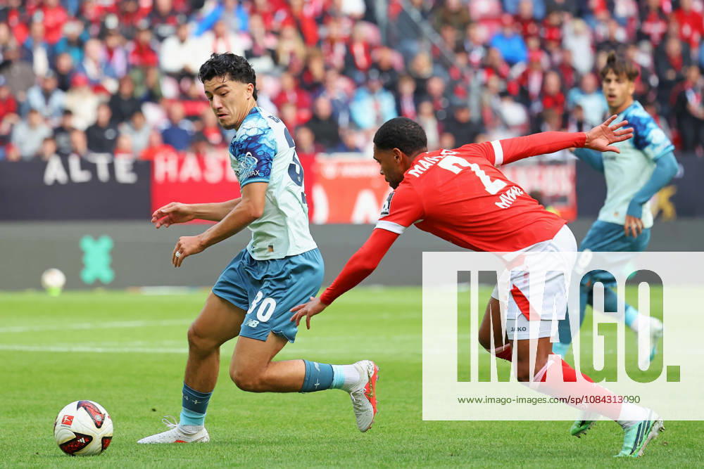 Mainz, Germany, October 10, 2026, Bundesliga 1 2026–2027, Matchday 5: FSV Mainz 05 vs. Bayer 04 Leverkusen. Pictured from left: Ibrahim Maza (B04) in a tackle against Phillipp Mwene (M05). DFL regulations prohibit any use of photographs as image sequences and or quasi-video. Mewa Arena, Rhineland-Palatinate