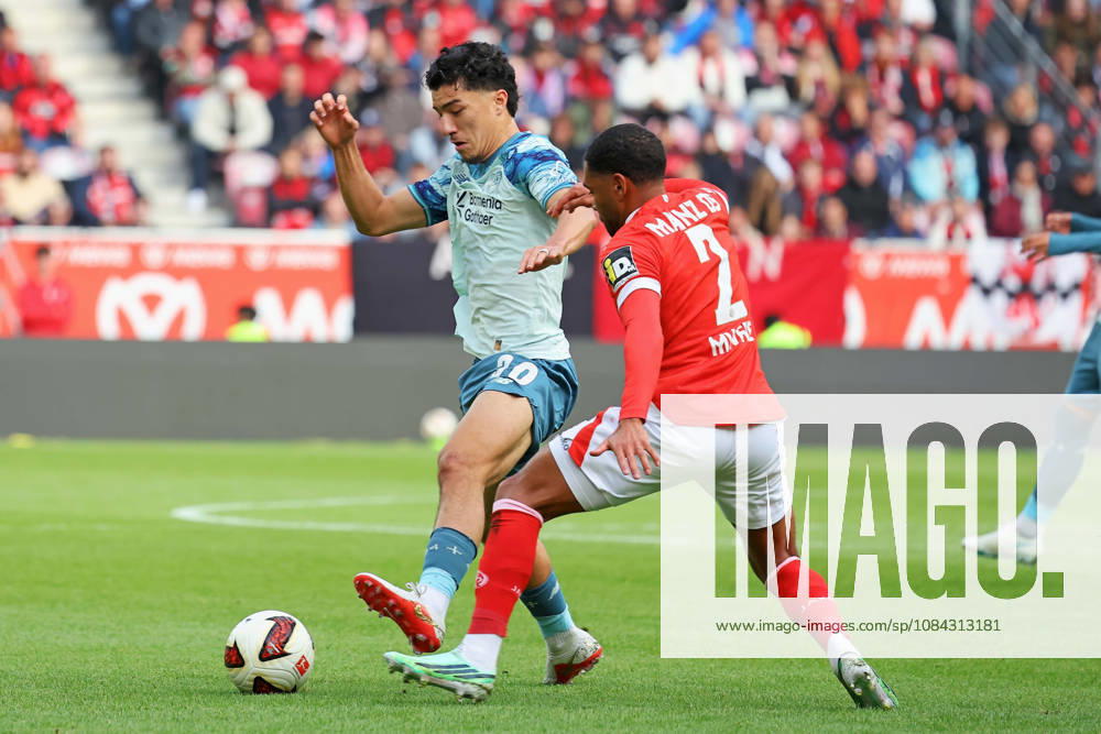 Mainz, Germany, October 10, 2026, Bundesliga 1 2026–2027, Matchday 5: FSV Mainz 05 vs. Bayer 04 Leverkusen. Pictured, from left, in a tackle: Ibrahim Maza (B04) against Phillipp Mwene (M05). DFL regulations prohibit any use of photographs as image sequences and or quasi-video. Mewa Arena, Rhineland-Palatinate