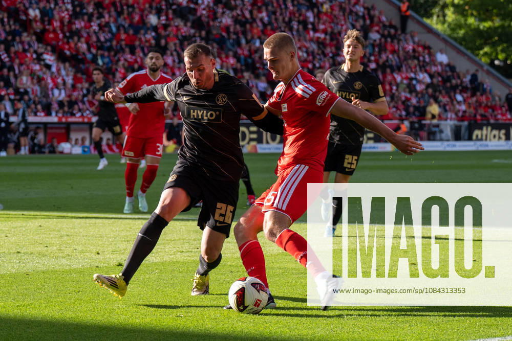 German Soccer Bundesliga 1, Matchday 5, 2026–2027, 1. FC Union Berlin vs. SV Elversberg on October 10, 2026, at the Stadion An der Alten Försterei in Berlin; a tackle between Luca Sirch of SV Elversberg (26) and Tom Rothe of 1. FC Union Berlin (15)