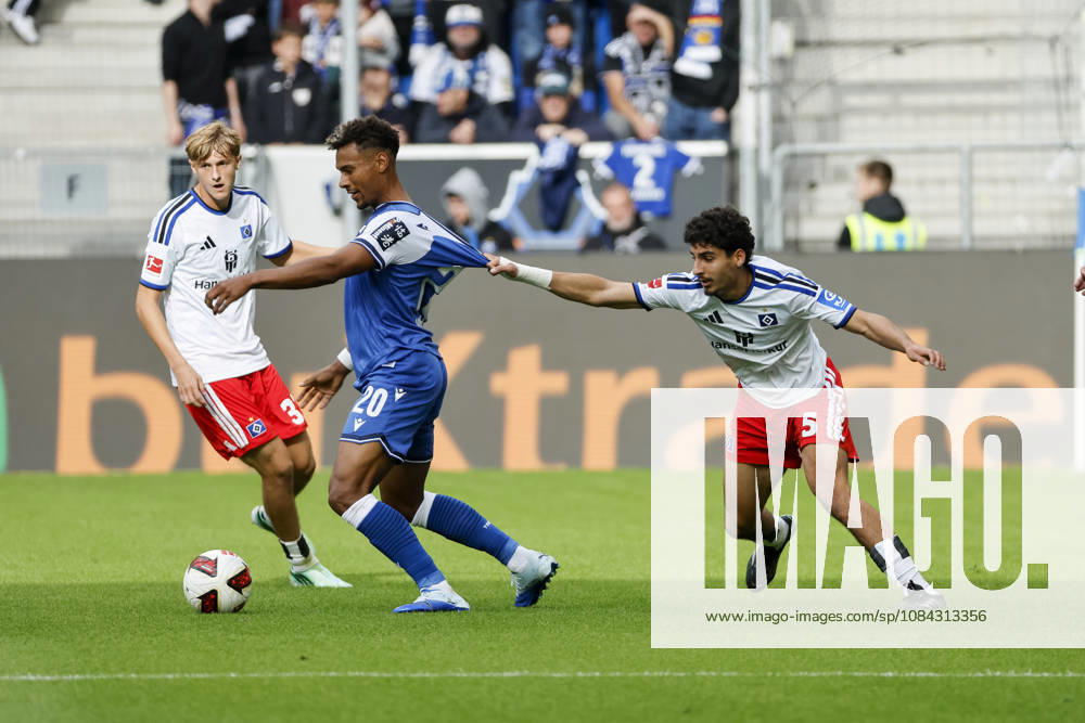Bambase Conte of TSG Hoffenheim, 20, and Martin Adeline of Hamburger SV, 05, in a tackle, Germany, soccer, Bundesliga 1, Matchday 5, 2026–2027, TSG Hoffenheim vs. Hamburger SV, October 10, 2026, Sinsheim SNP Arena, Germany