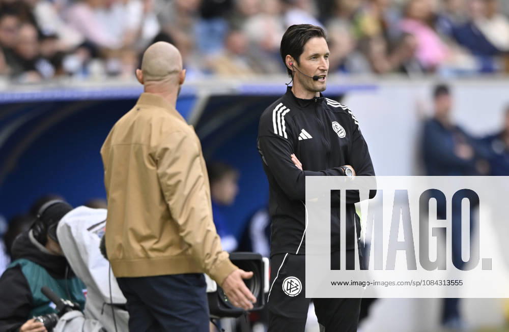 Coach Christian Ilzer of TSG 1899 Hoffenheim gets angry during a discussion with fourth official Dr. Matthias Joellenbeck following Ozan Kabak s injury; TSG 1899 Hoffenheim 05; referee Harm Osmers sends assistant coach off due to head injury from Fels; TSG 1899 Hoffenheim vs. Hamburger SV (HSV), October 10, 2026. DFL regulations prohibit any use of photographs as image sequences and or quasi-video. TSG 1899 Hoffenheim vs. Hamburger SV (HSV)