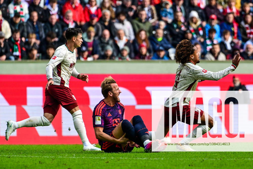 Germany, Soccer, Men s, Bundesliga 1, Matchday 5, FC Augsburg vs. FC Bayern Munich; Han Noah Massengo (FC Augsburg) scores 4 goals; Harry Kane (Bayern Munich) takes a shot to the calf; Augsburg WWK Arena, Bayern, Germany