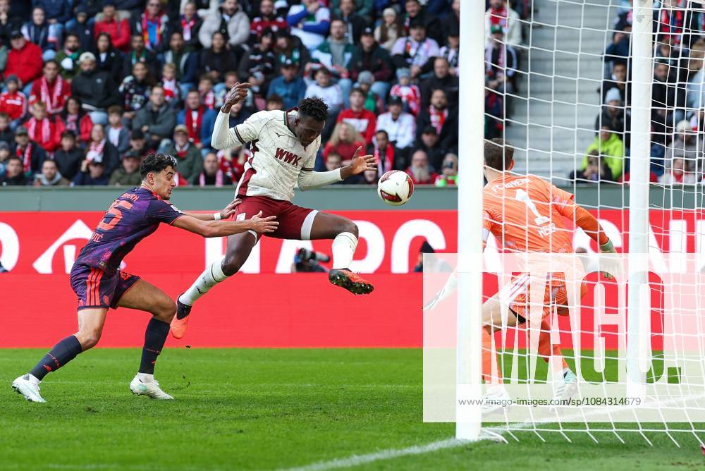 One-on-one, action, featuring Alexandar Pavlovic 45 FC Bayern Munich, Juma Bah 35 FC Augsburg, Manuel Neuer 1 FC Bayern Munich, FC Augsburg vs. FC Bayern Munich, soccer, Bundesliga 1, Matchday 5, October 10, 2026. DFB and DFL regulations prohibit any use of photographs as image sequences and or quasi-video. Augsburg, Bayern, Germany