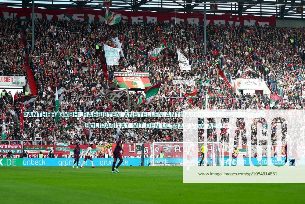 FC Bayern Munich fans with a message, banner, AEV, Augsburger Panther, FC Augsburg vs. FC Bayern Munich, soccer, Bundesliga 1, Matchday 5, October 10, 2026. DFB and DFL regulations prohibit any use of photographs as image sequences and or quasi-video. Augsburg, Bayern, Germany
