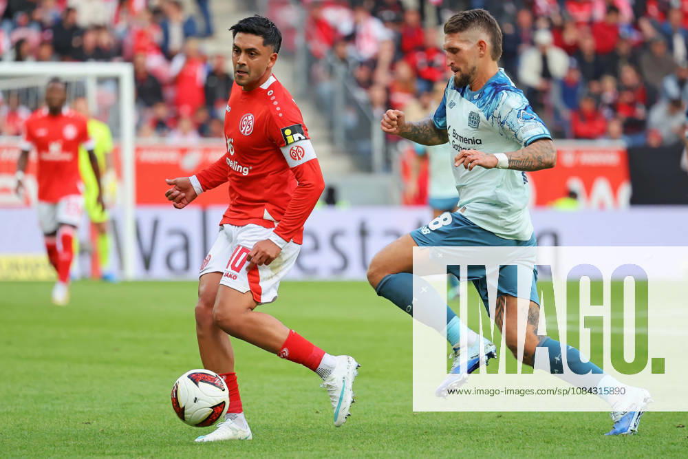Mainz, Germany, October 10, 2026, Bundesliga 1 2026–2027, Matchday 5, FSV Mainz 05 vs. Bayer 04 Leverkusen. Pictured, from left, in a tackle: Nadiem Amiri (M05) vs. Robert Andrich (B04). DFL regulations prohibit any use of photographs as image sequences and or quasi-video. Mewa Arena, Rhineland-Palatinate