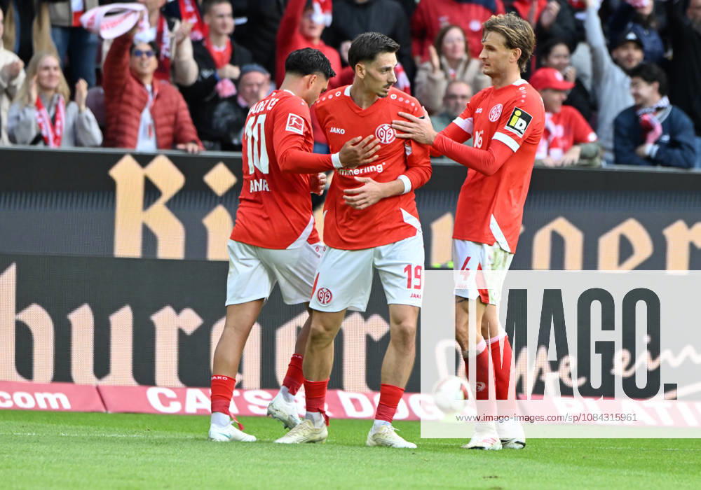 Soccer Bundesliga Season 2026–2027 Mewa Arena Mainz, October 10, 2026 1 FSV Mainz 05 (mz) vs. Bayer Leverkusen (lev) Celebrations after the 2–2 draw; from left: Nadiem AMIRI 1 FSV Mainz 05, Two-goal scorer Anthony CACI 1 FSV Mainz 05 and Stefan POSCH 1 FSV Mainz 05 DFL REGULATIONS PROHIBIT ANY USE OF PHOTOGRAPHS AS IMAGE SEQUENCES AND OR QUASI-VIDEO; ; NATIONAL AND INTERNATIONALATIONAL NEWS AGENCIES OUT Soccer Bundesliga 1 FSV Mainz 05