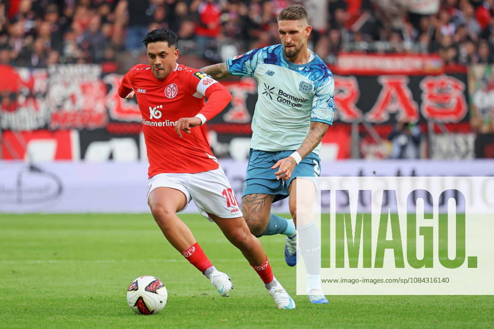 Mainz, Germany, October 10, 2026, Bundesliga 1 2026–2027, Matchday 5: FSV Mainz 05 vs. Bayer 04 Leverkusen. Pictured, from left, in a tackle: Nadiem Amiri (M05) vs. Patrik Schick (B04). DFL regulations prohibit any use of photographs as image sequences and or quasi-video. Mewa Arena, Rhineland-Palatinate