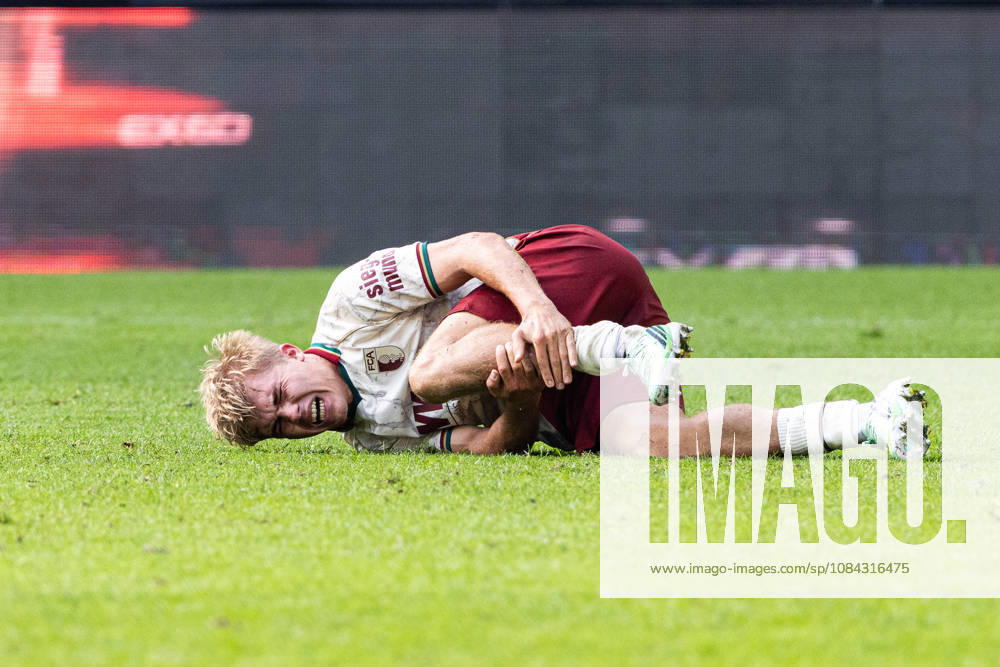 Germany: FC Augsburg vs. FC Bayern Munich, Bundesliga 1, Matchday 5, 2026–27 Season, WWK Arena Augsburg Hennes Behrens, FC Augsburg, 16 lying on the ground in pain, Augsburg WWK Arena, Bayern, Germany